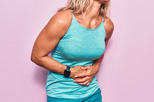woman holding hands on stomach