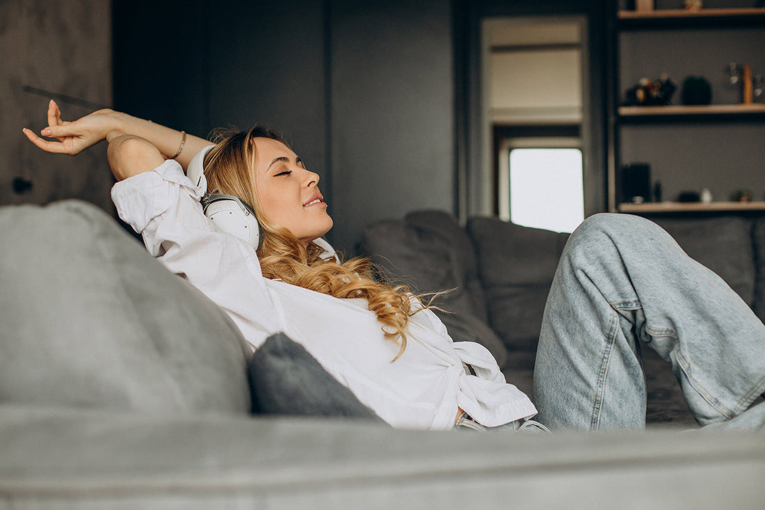 relaxed woman stretching out sitting on couch