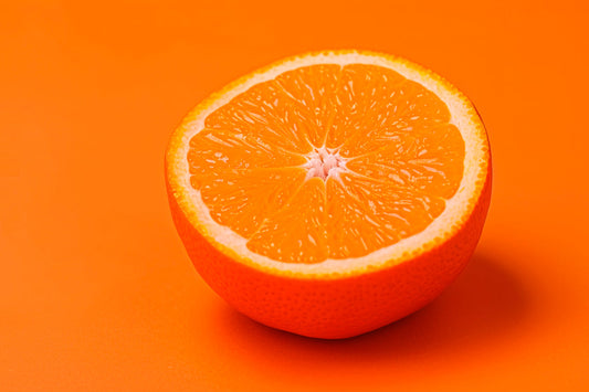 cut in half orange on a flat orange background