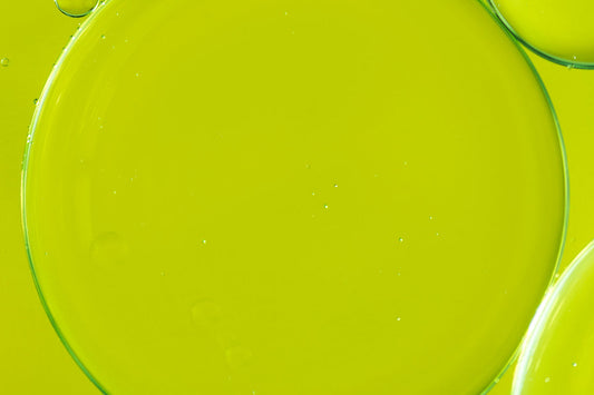 drop of oil on a green background